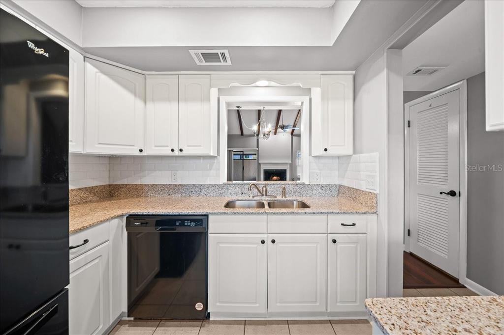 3824 Northeast 19th St Circle Ocala, FL 34470 - Photo 17 of 67 a kitchen with a sink stove and cabinets