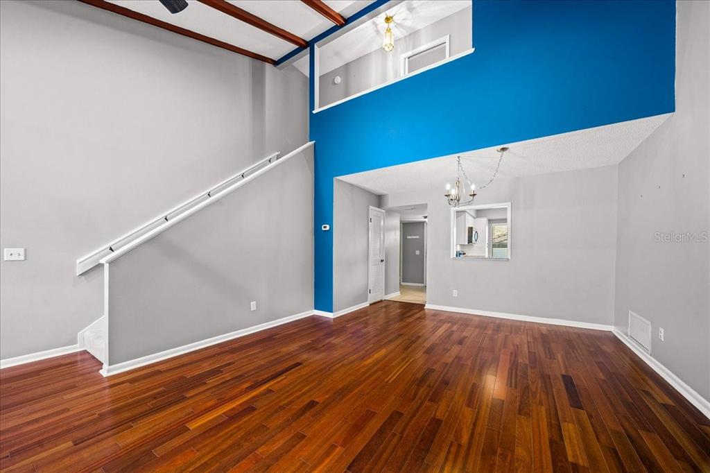3824 Northeast 19th St Circle Ocala, FL 34470 - Photo 20 of 67 a view of a room with wooden floor and white walls