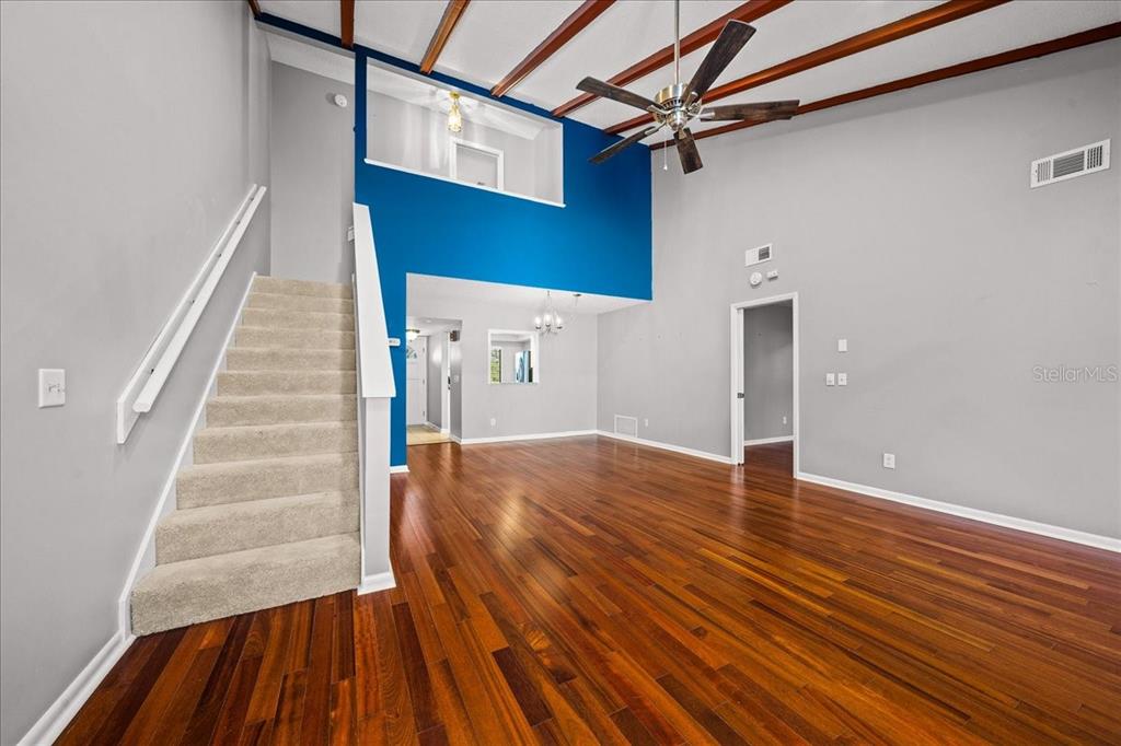 3824 Northeast 19th St Circle Ocala, FL 34470 - Photo 23 of 67 a view of a room with wooden floor and stairs