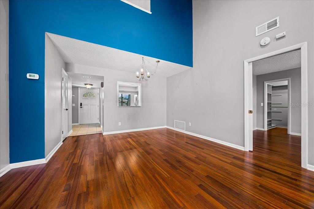 3824 Northeast 19th St Circle Ocala, FL 34470 - Photo 24 of 67 a view of an empty room with wooden floor and a window