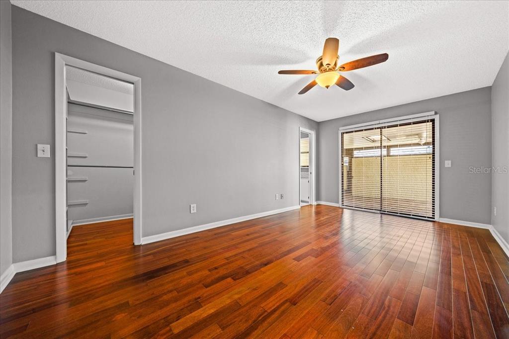 3824 Northeast 19th St Circle Ocala, FL 34470 - Photo 27 of 67 a view of empty room with wooden floor and fan
