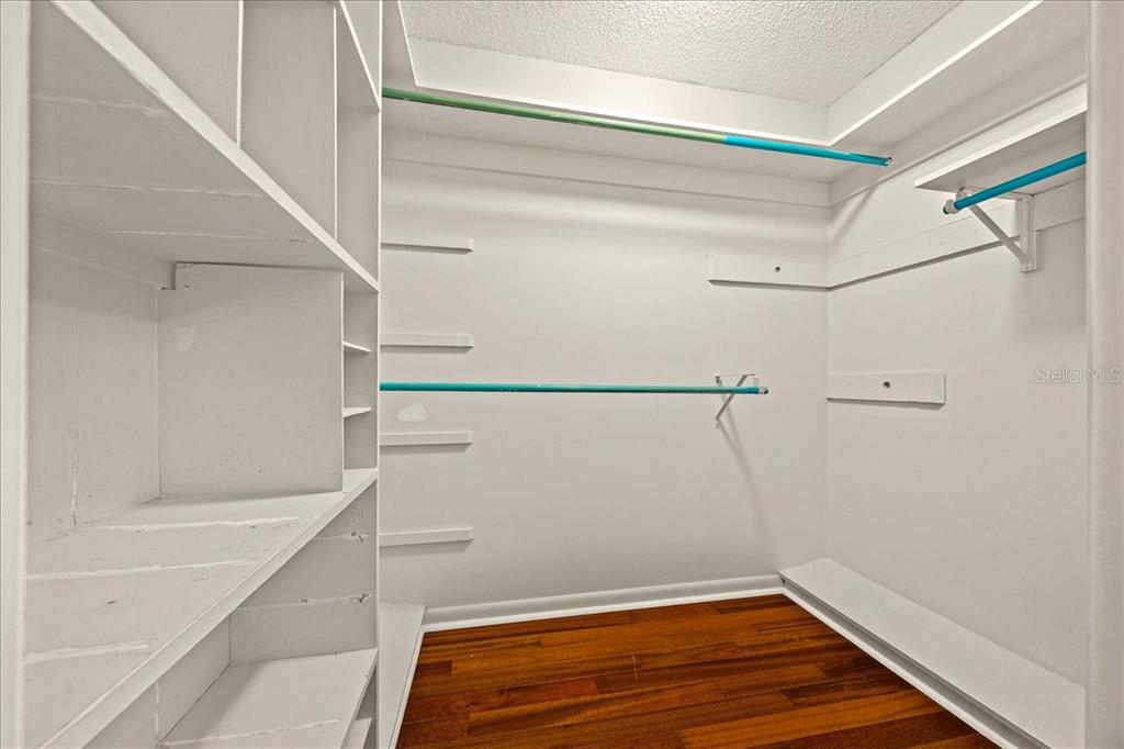 3824 Northeast 19th St Circle Ocala, FL 34470 - Photo 29 of 67 a bathroom with a shower and wooden floor