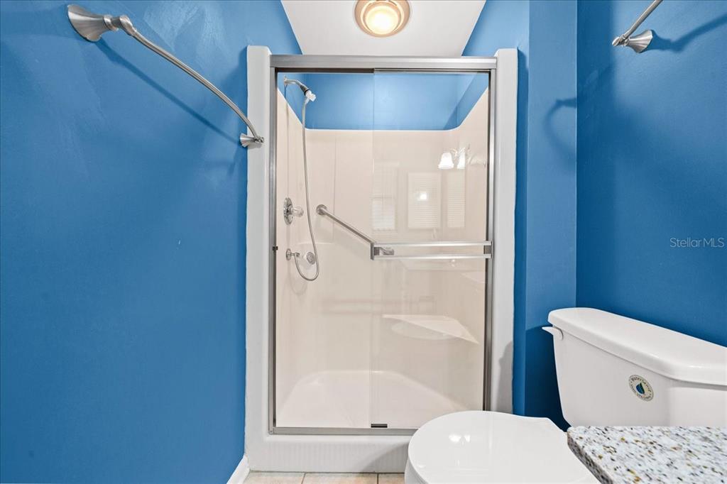 3824 Northeast 19th St Circle Ocala, FL 34470 - Photo 33 of 67 a white toilet sitting next to a bathroom sink