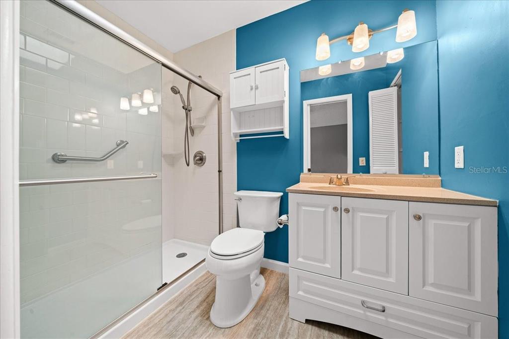 3824 Northeast 19th St Circle Ocala, FL 34470 - Photo 38 of 67 a bathroom with a sink a toilet and shower