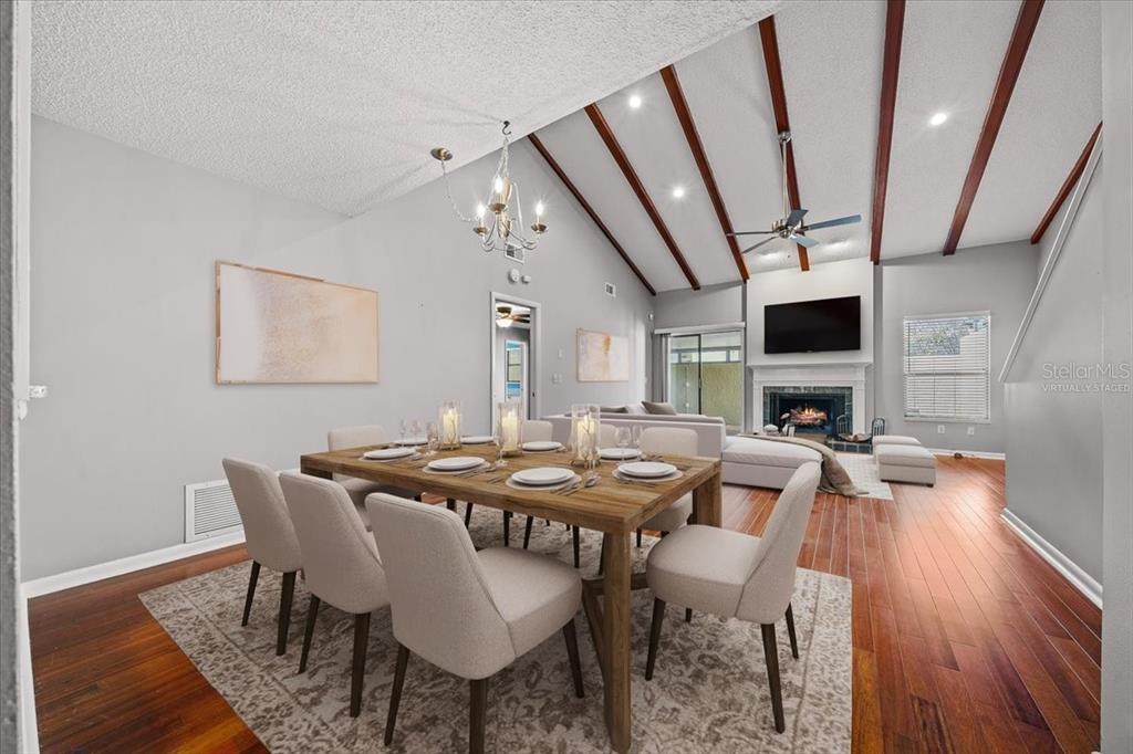 3824 Northeast 19th St Circle Ocala, FL 34470 - Photo 49 of 67 a view of a dining room with furniture wooden floor and flat screen tv