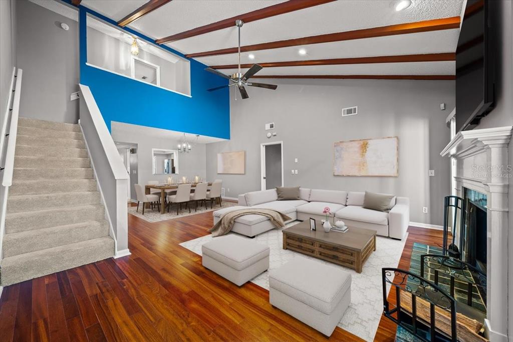 3824 Northeast 19th St Circle Ocala, FL 34470 - Photo 50 of 67 a living room with furniture and a flat screen tv