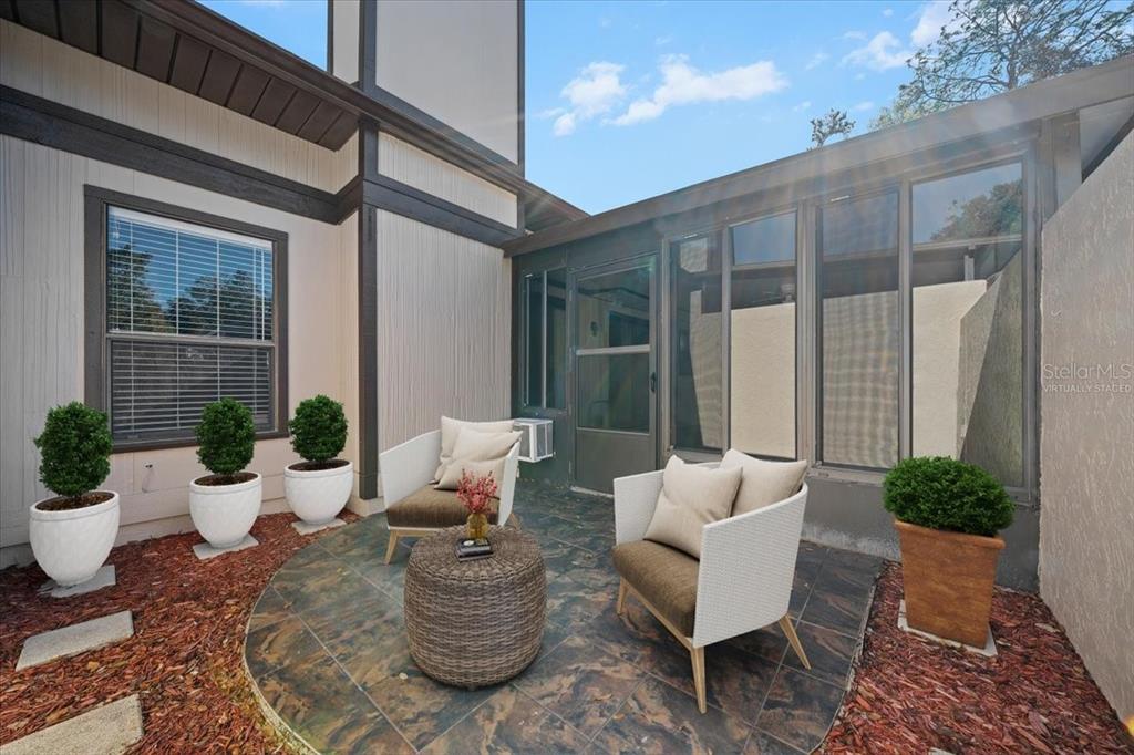 3824 Northeast 19th St Circle Ocala, FL 34470 - Photo 52 of 67 a view of a patio with couches and potted plants