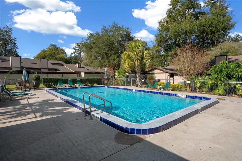 3824 Northeast 19th St Circle Ocala, FL 34470 - Photo 61 of 67 a view of a swimming pool with a patio