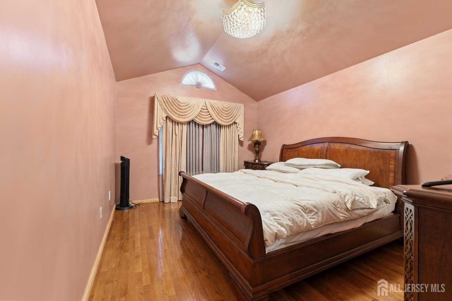 7 Spring Drive Dayton, NJ 08810 - Photo 13 of 24 a bedroom with a bed and a chandelier