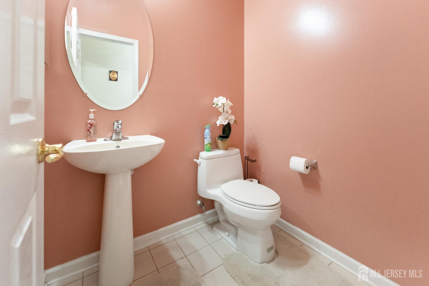 7 Spring Drive Dayton, NJ 08810 - Photo 18 of 24 a bathroom with a sink a mirror and toilet