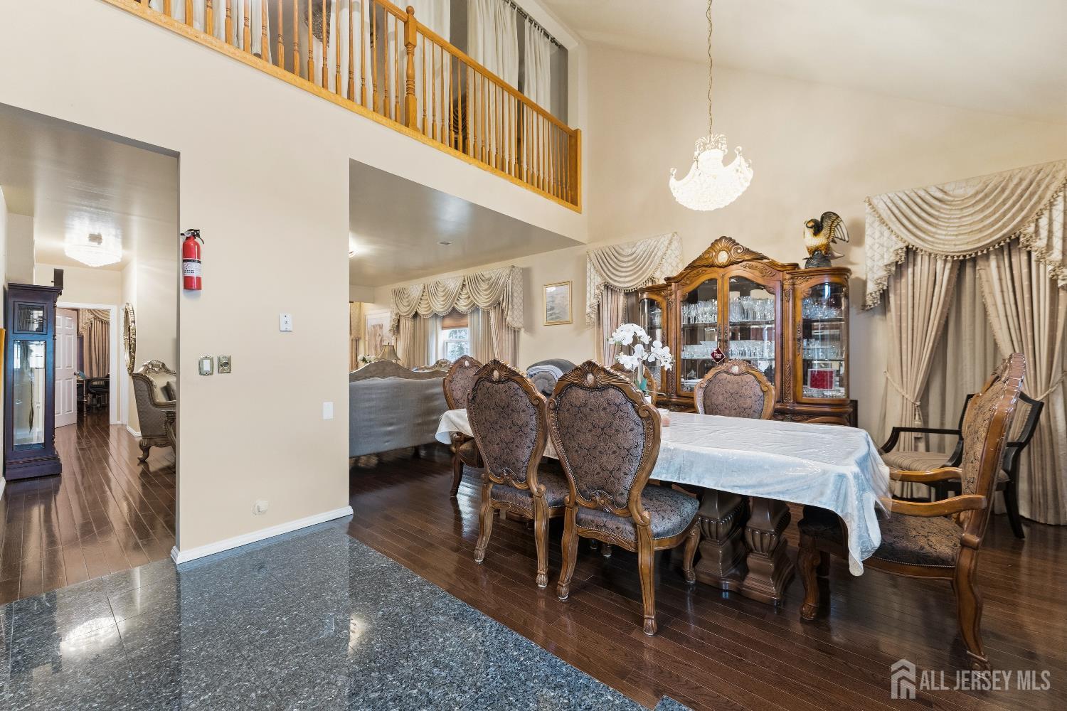 7 Spring Drive Dayton, NJ 08810 - Photo 5 of 24 a view of a dining room with furniture and wooden floor