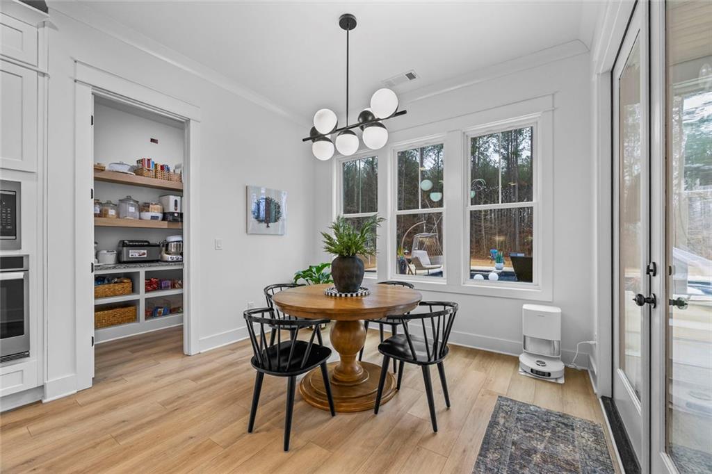 1159 Locklin Road Monroe, GA 30655 - Photo 11 of 63 a view of a dining room with furniture window and wooden floor