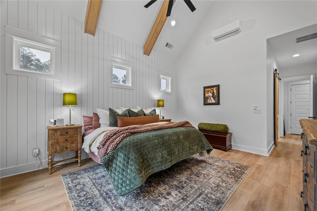 1159 Locklin Road Monroe, GA 30655 - Photo 15 of 63 a bedroom with a bed and wooden floor