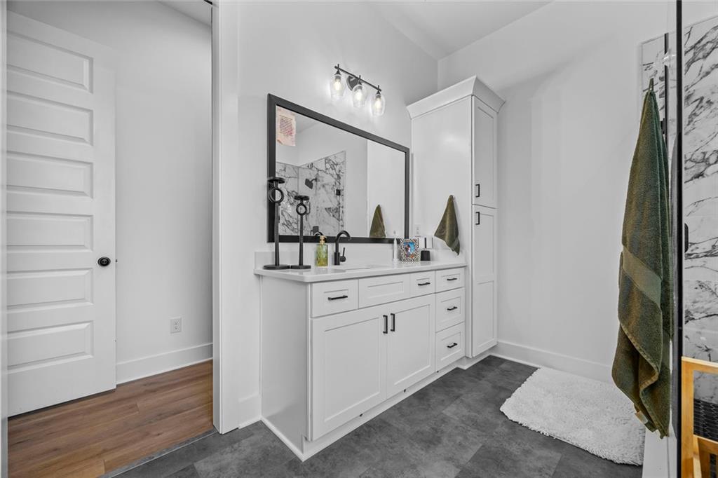 1159 Locklin Road Monroe, GA 30655 - Photo 18 of 63 a bathroom with a sink and a mirror