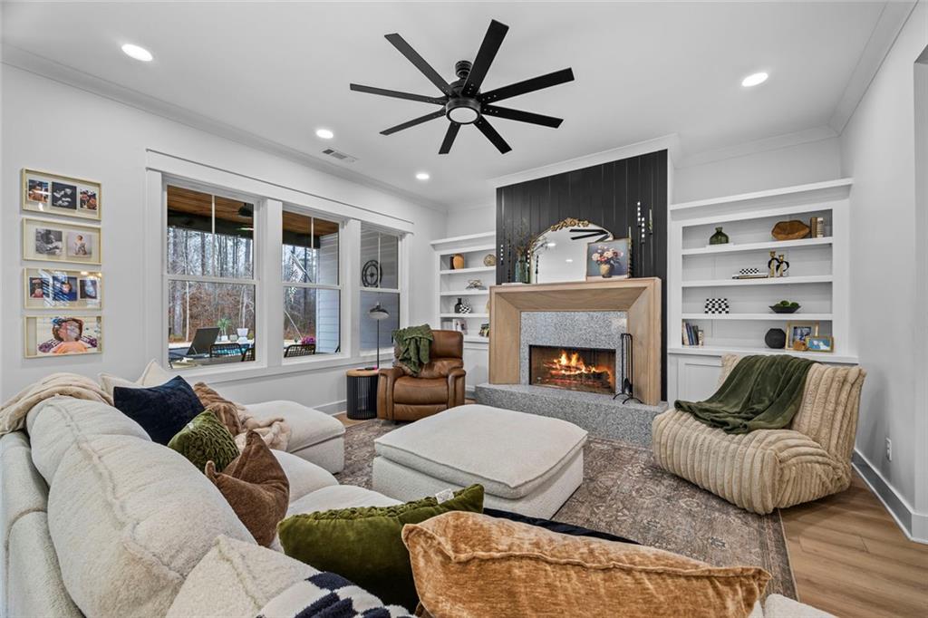 1159 Locklin Road Monroe, GA 30655 - Photo 25 of 63 a living room with furniture and a fireplace