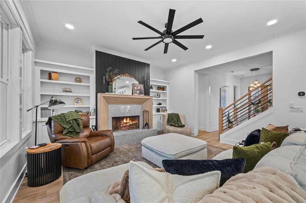 1159 Locklin Road Monroe, GA 30655 - Photo 26 of 63 a living room with furniture a fireplace and a window