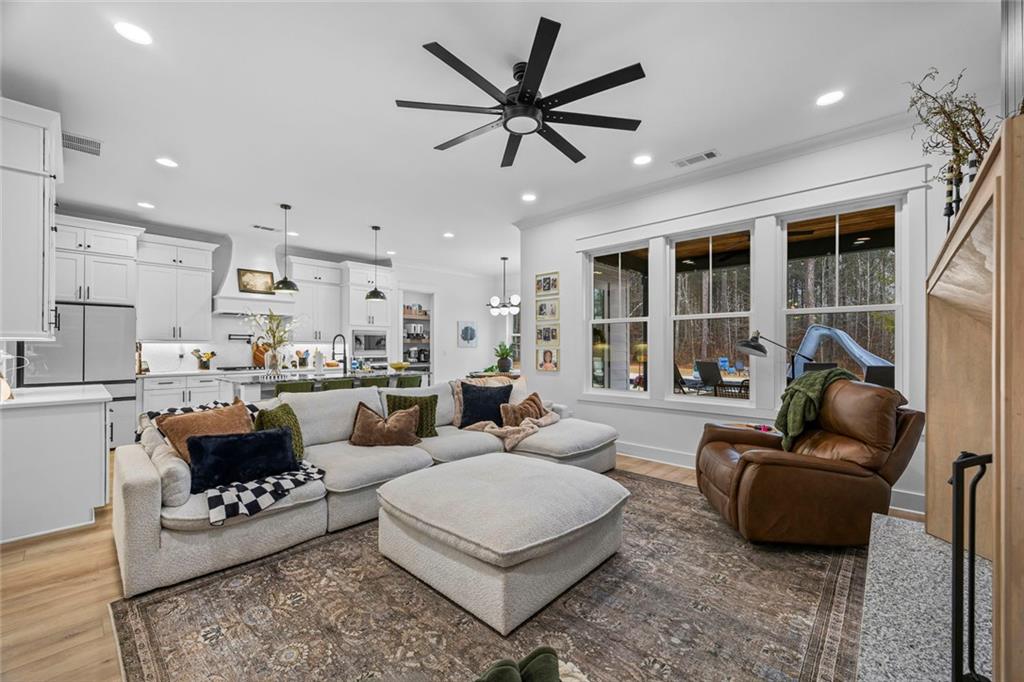1159 Locklin Road Monroe, GA 30655 - Photo 27 of 63 a living room with furniture fireplace and a large window