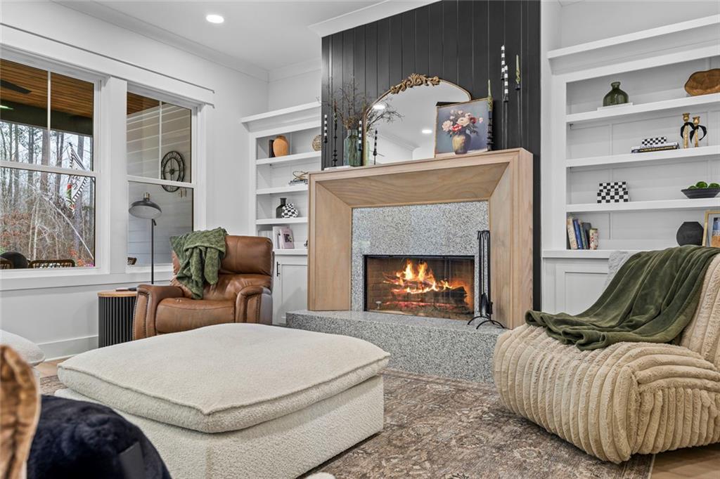 1159 Locklin Road Monroe, GA 30655 - Photo 28 of 63 a living room with furniture and a fireplace