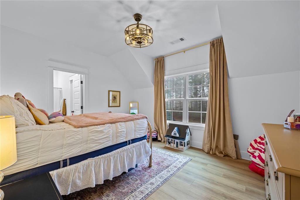 1159 Locklin Road Monroe, GA 30655 - Photo 31 of 63 a bedroom with a bed and window