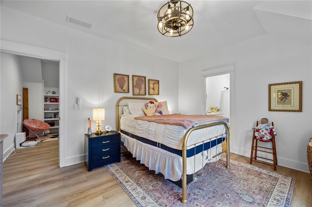 1159 Locklin Road Monroe, GA 30655 - Photo 32 of 63 a bedroom with a bed and a table