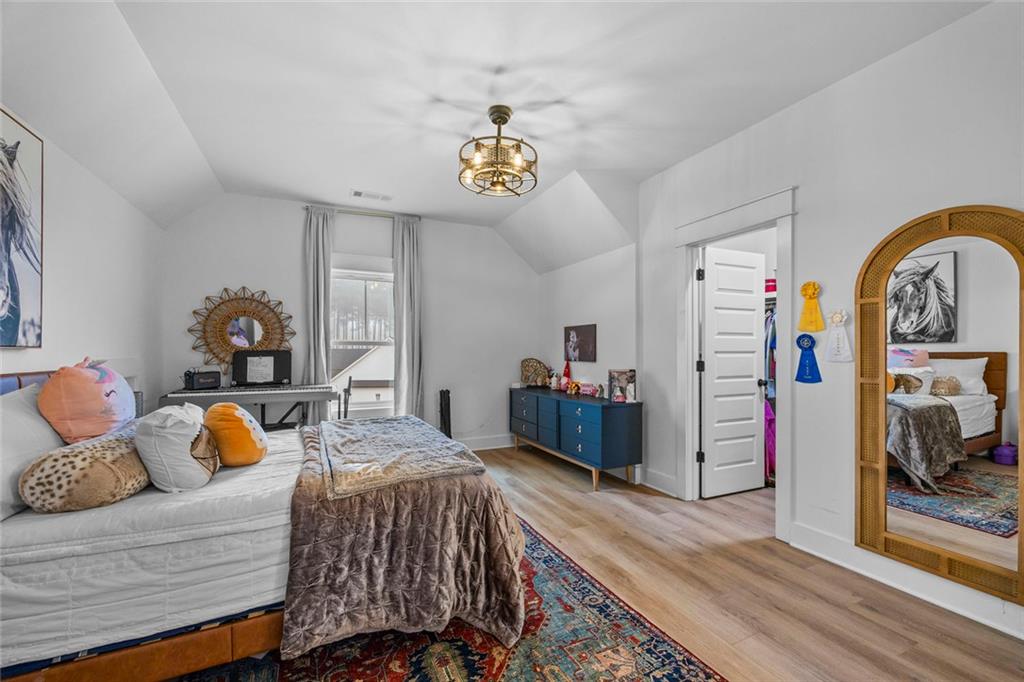 1159 Locklin Road Monroe, GA 30655 - Photo 36 of 63 a bedroom with a bed and wooden floor