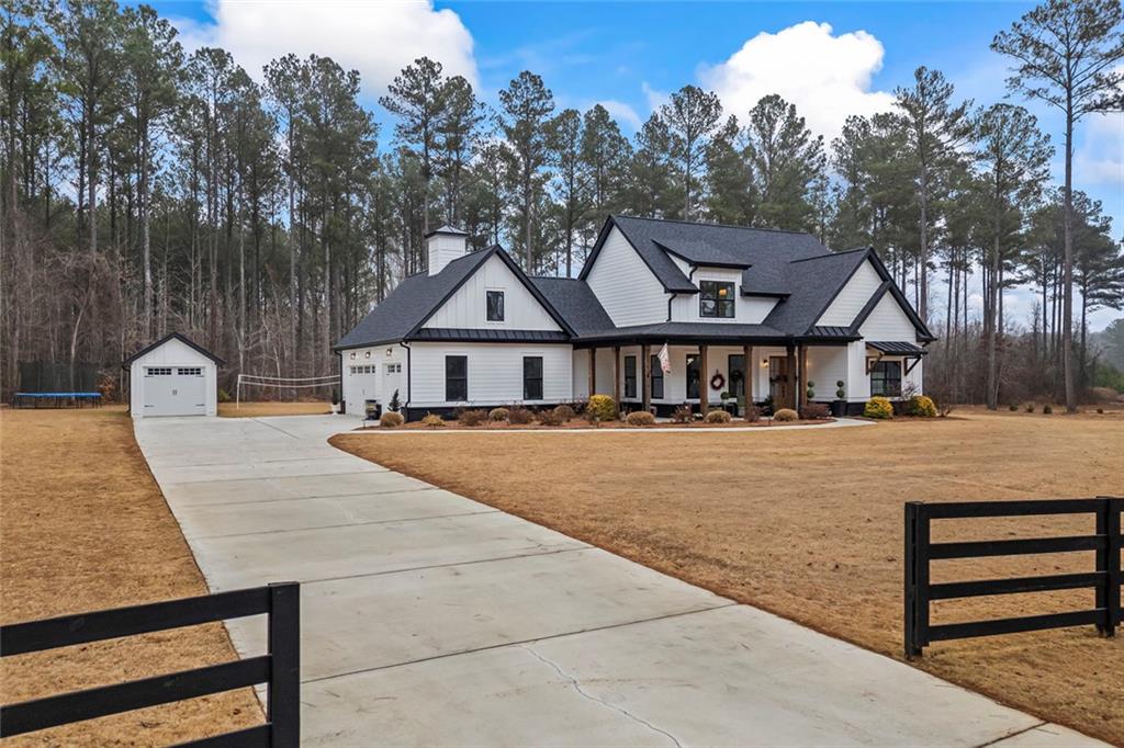 1159 Locklin Road Monroe, GA 30655 - Photo 47 of 63 a front view of a house with a yard