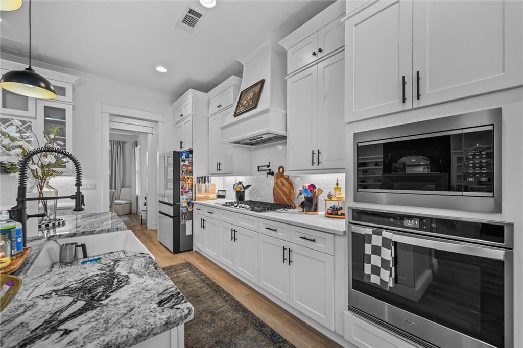 1159 Locklin Road Monroe, GA 30655 - Photo 5 of 63 a kitchen with a stove and a refrigerator