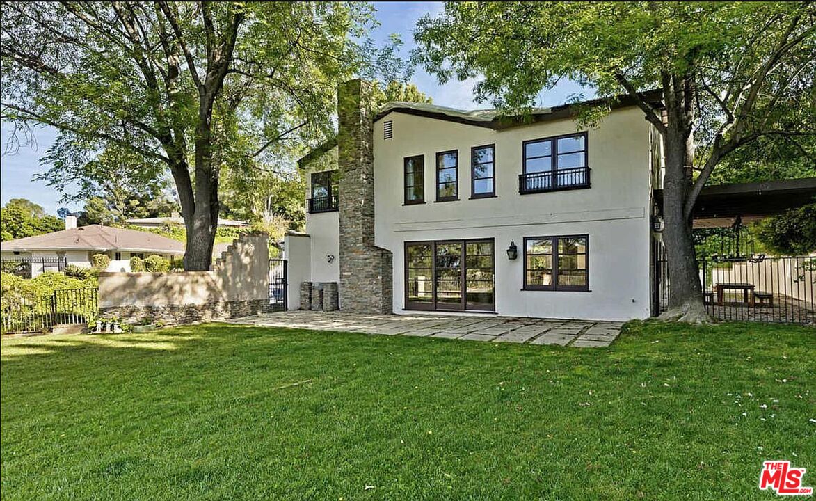 a house view with a garden space