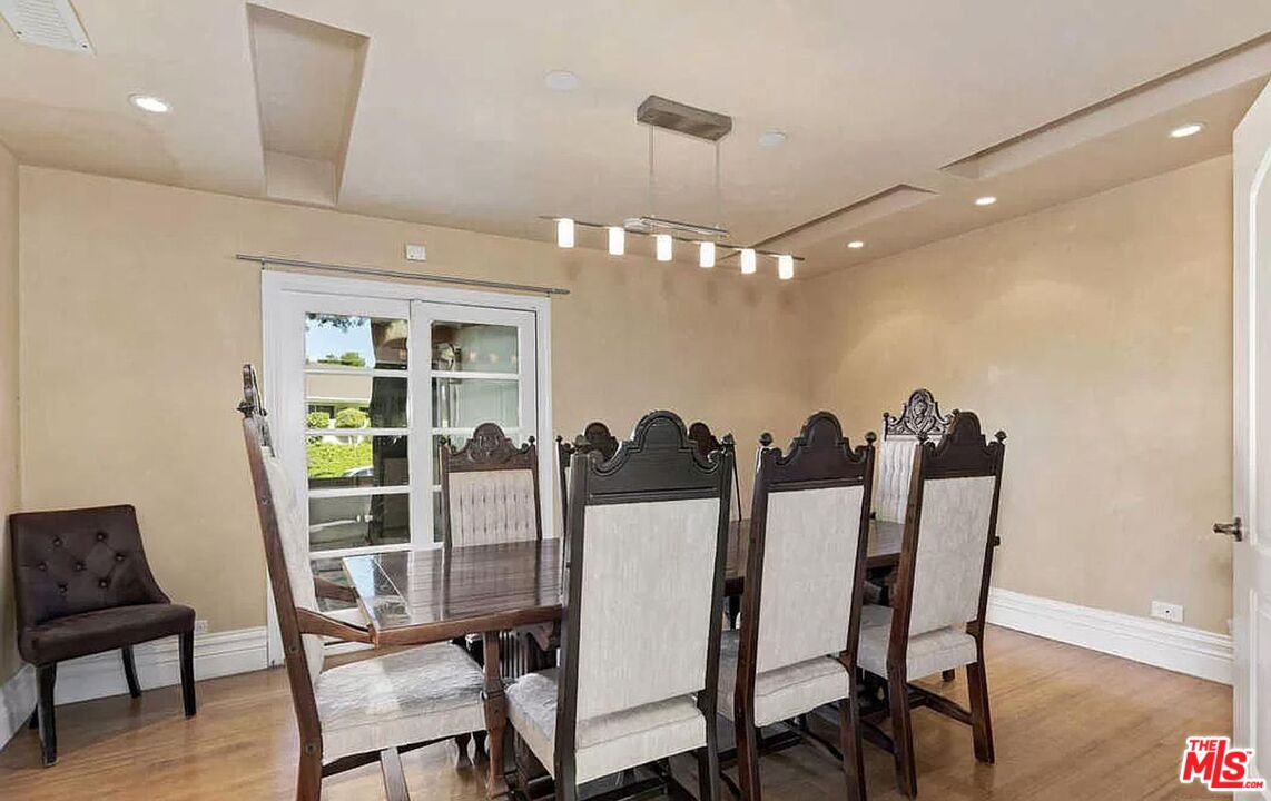 3441 White Rose Way Encino, CA 91436 - Photo 12 of 22 a view of a dining room with furniture and wooden floor