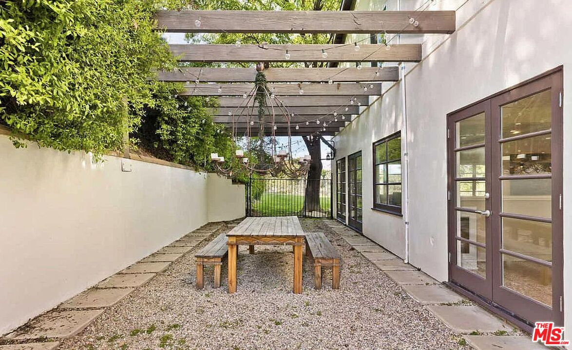 3441 White Rose Way Encino, CA 91436 - Photo 15 of 22 a patio with table and chairs