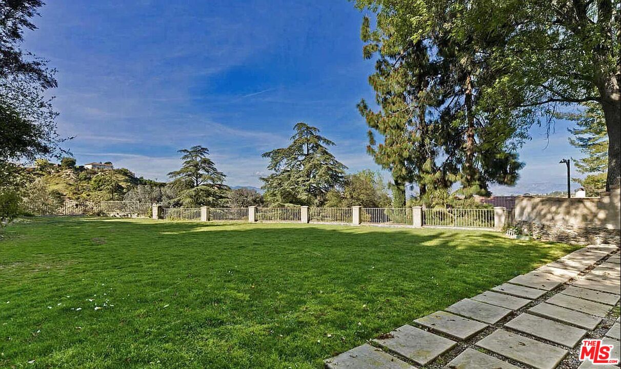 3441 White Rose Way Encino, CA 91436 - Photo 17 of 22 a view of a golf course with a garden