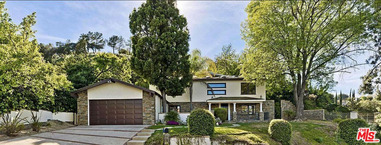 3441 White Rose Way Encino, CA 91436 - Photo 22 of 22 a front view of a house with garden