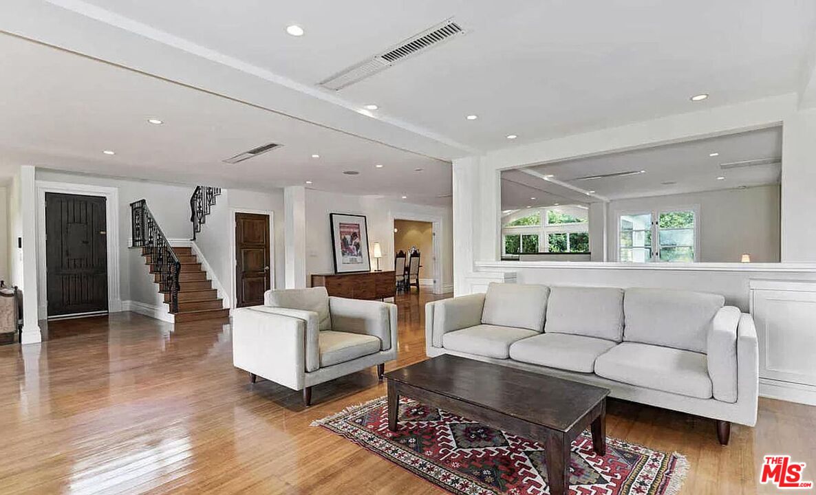 3441 White Rose Way Encino, CA 91436 - Photo 4 of 22 a living room with furniture and wooden floor
