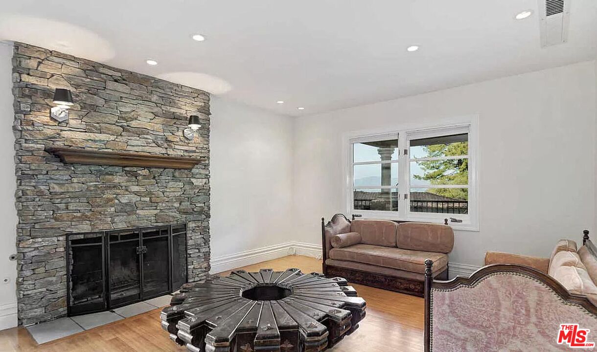 3441 White Rose Way Encino, CA 91436 - Photo 7 of 22 a living room with furniture and a fireplace