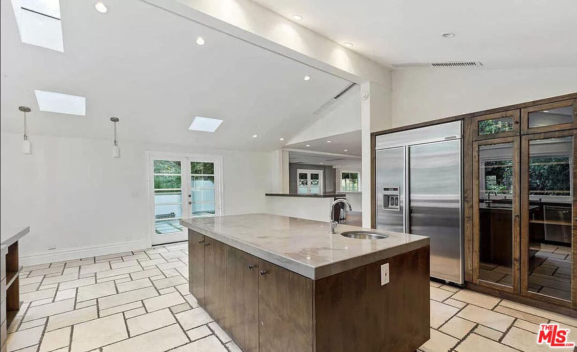 3441 White Rose Way Encino, CA 91436 - Photo 10 of 22 a kitchen with a sink a counter top space and stainless steel appliances