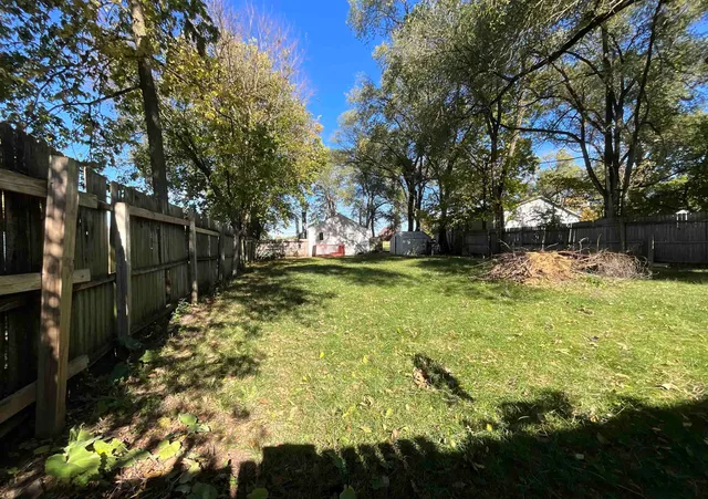 a view of backyard with a table and chair