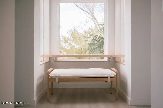 a white toilet sitting next to a window