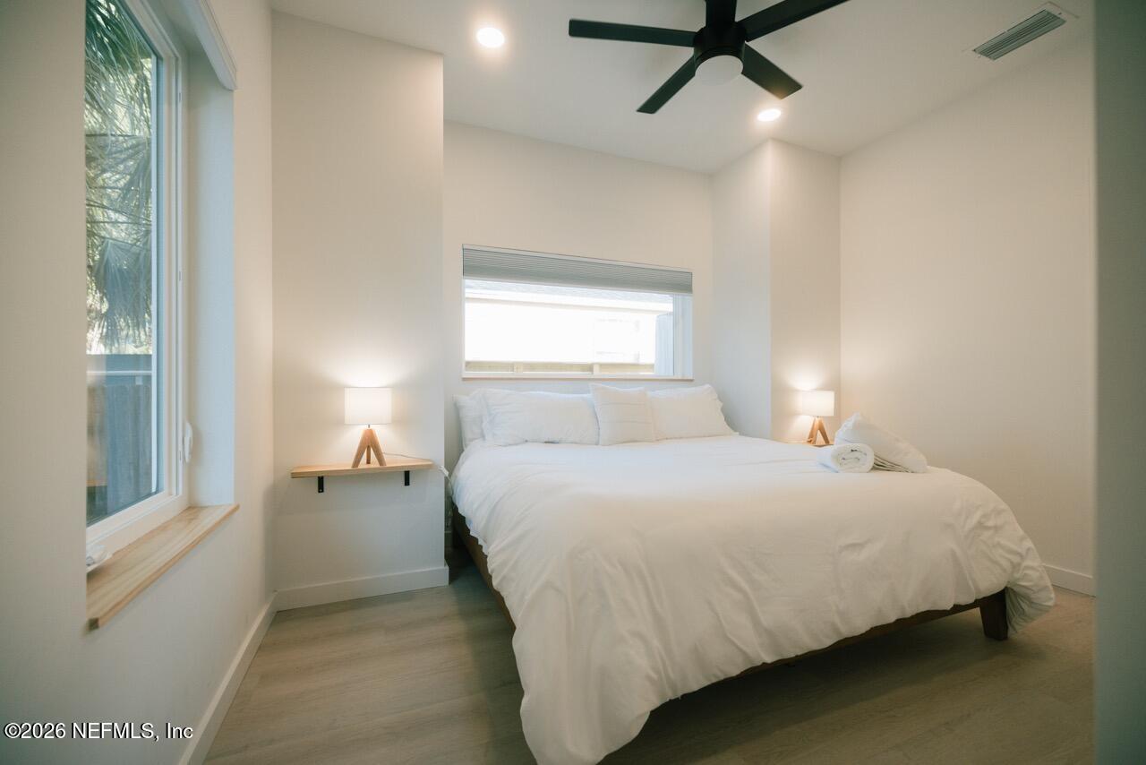3318 Lewis Speedway St. Augustine, FL 32084 - Photo 15 of 23 a bedroom with a bed and window