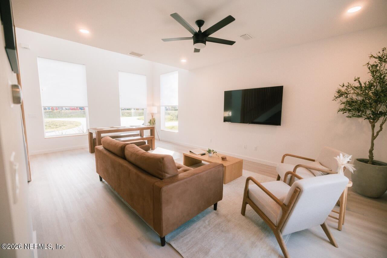 3318 Lewis Speedway St. Augustine, FL 32084 - Photo 3 of 23 a living room with furniture and a flat screen tv