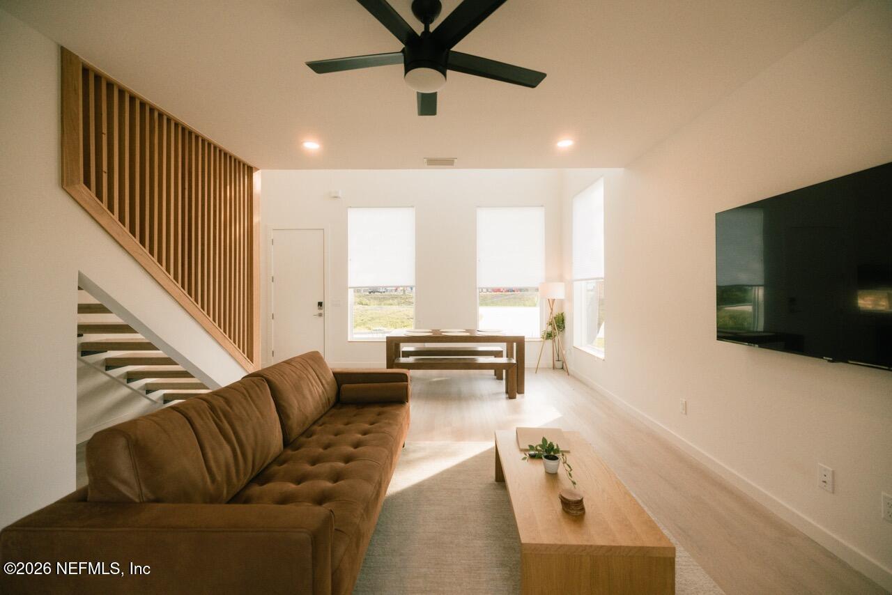 3318 Lewis Speedway St. Augustine, FL 32084 - Photo 4 of 23 a living room with furniture tv and a window