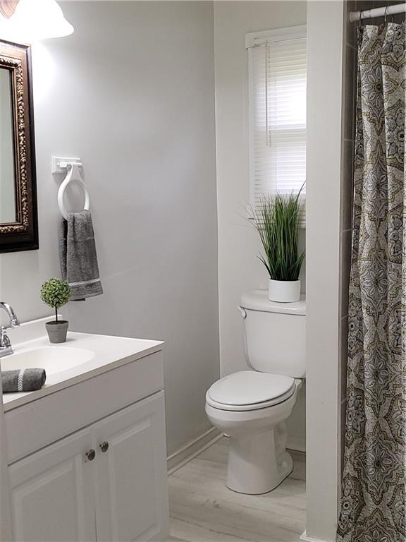 130 Pletcher Road White, PA 15490 - Photo 15 of 22 a bathroom with a toilet sink and mirror