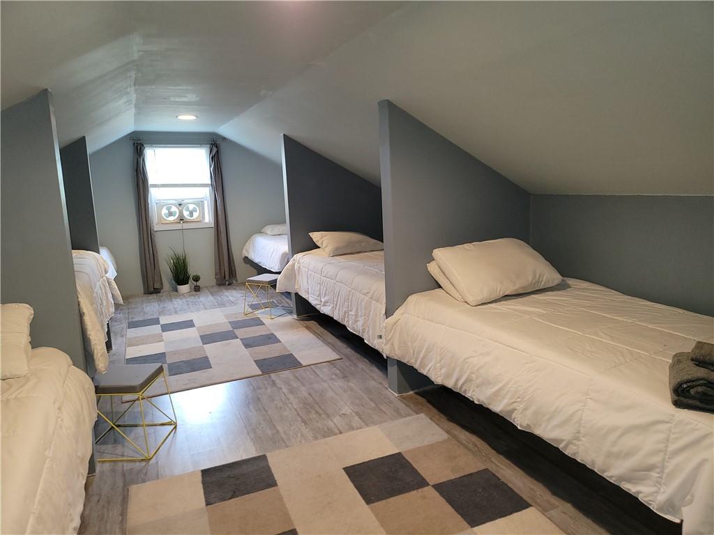 130 Pletcher Road White, PA 15490 - Photo 17 of 22 a bedroom with double bed and a large mirror next to a window