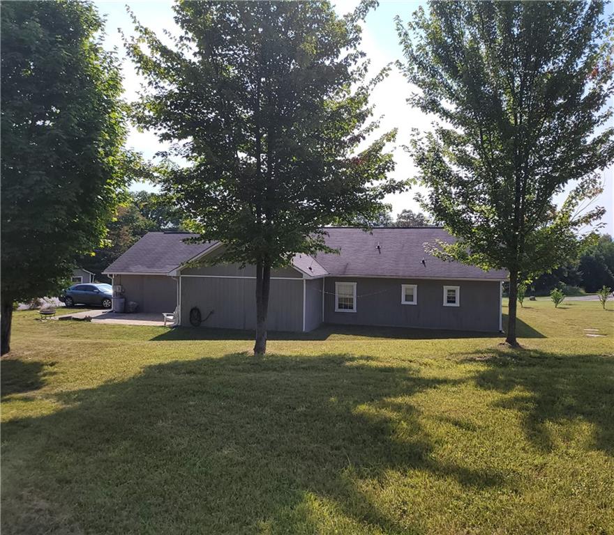 130 Pletcher Road White, PA 15490 - Photo 20 of 22 a view of a house with a yard and a large tree