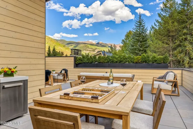 a view of a chair and table in a room