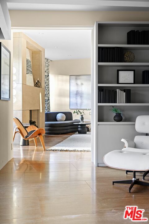 11496 Orum Road Los Angeles, CA 90049 - Photo 20 of 30 a living room with furniture and a flat screen tv