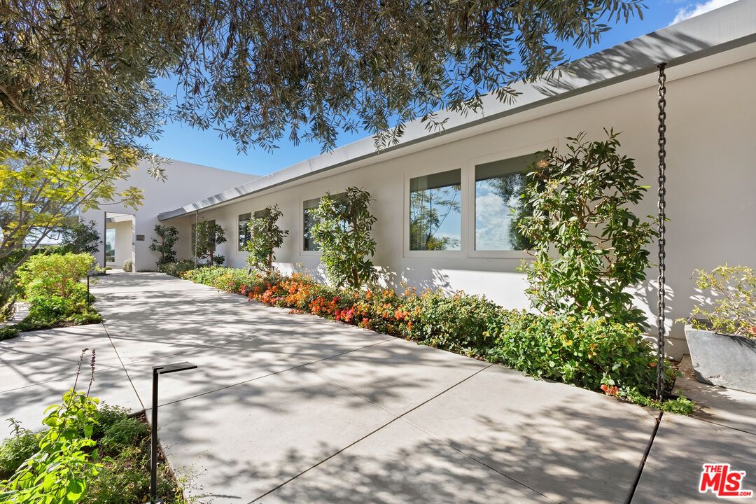 11496 Orum Road Los Angeles, CA 90049 - Photo 2 of 30 a view of a backyard with potted plants