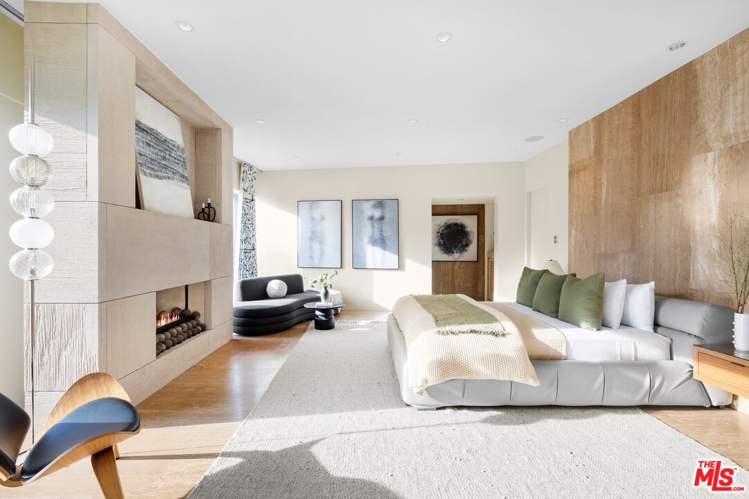 11496 Orum Road Los Angeles, CA 90049 - Photo 21 of 30 a bedroom with a bed a couch and dresser