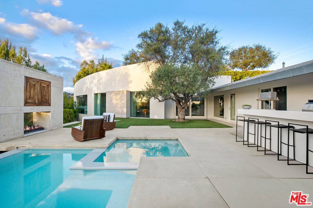 11496 Orum Road Los Angeles, CA 90049 - Photo 26 of 30 a view of a house with a patio