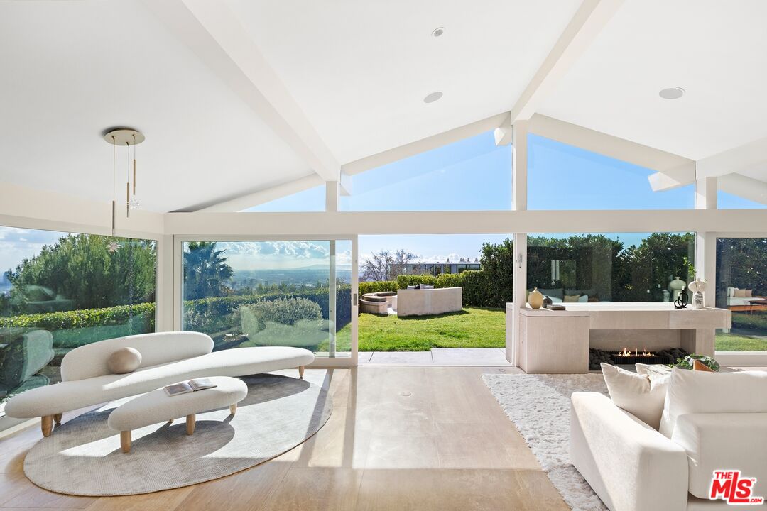 11496 Orum Road Los Angeles, CA 90049 - Photo 5 of 30 a view of a patio with couches chairs dining table and chairs