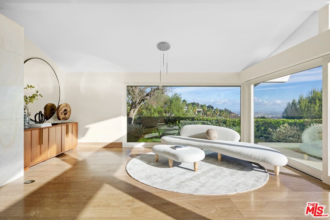 11496 Orum Road Los Angeles, CA 90049 - Photo 7 of 30 a living room with furniture and a large window
